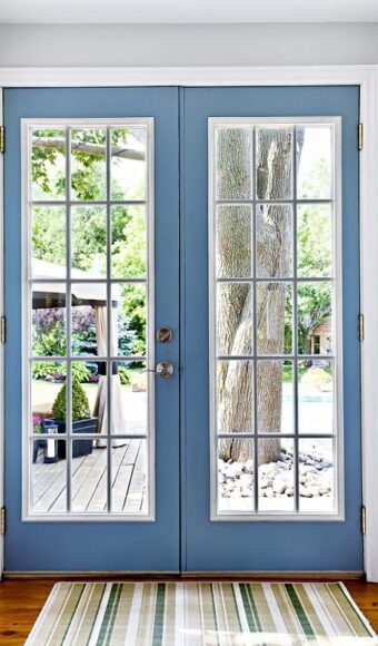 Blue french door with grilles