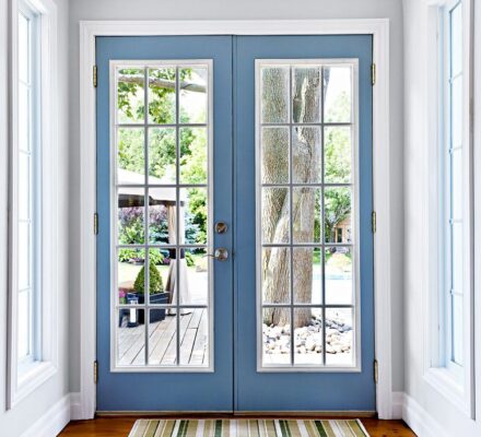 Blue french door with grilles