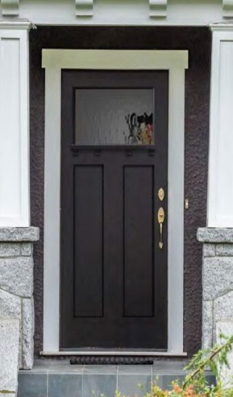 Brown fiberglass door with glass insert