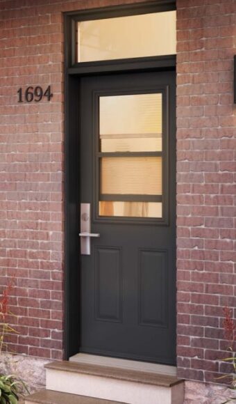 Brown steel door with glass insert and transom