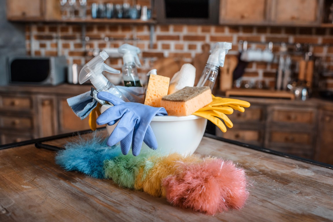Close up view of cleaning supplies on wooden table indoors